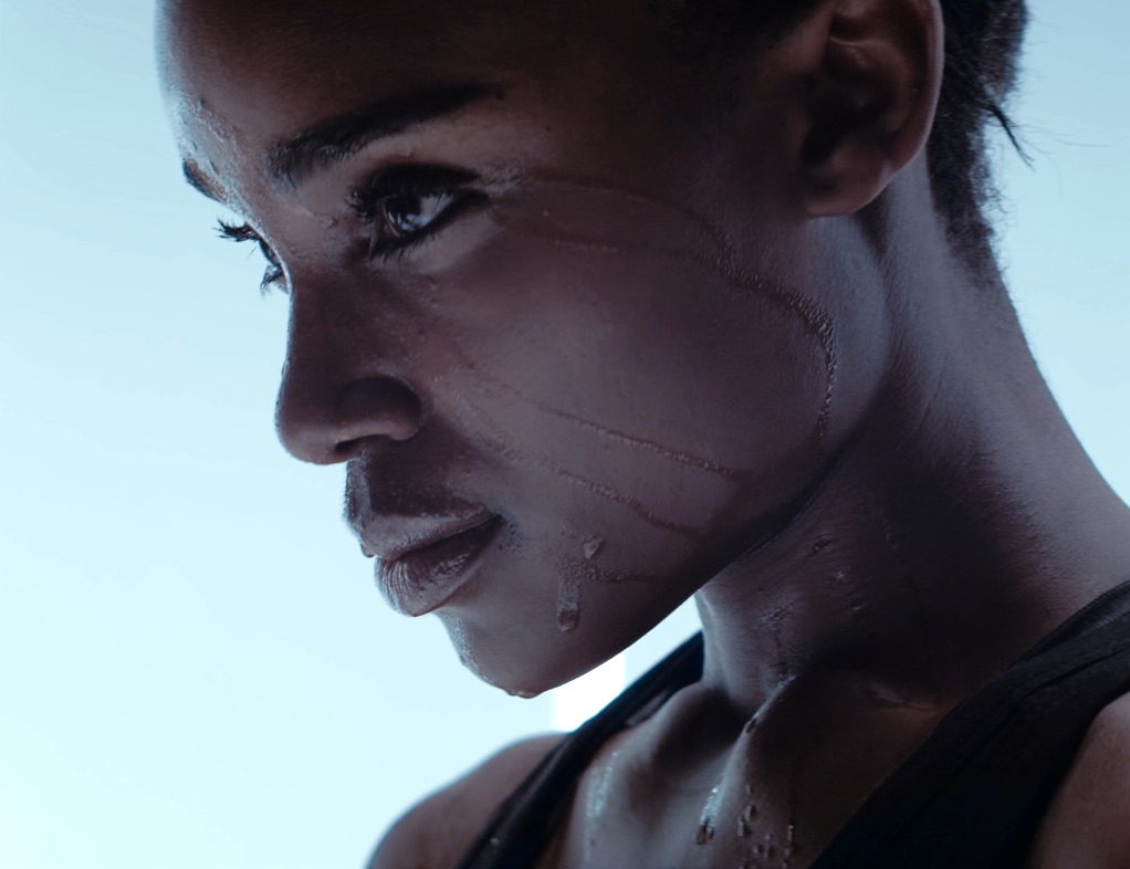 <close up of woman's face with sweat dripping down after workout