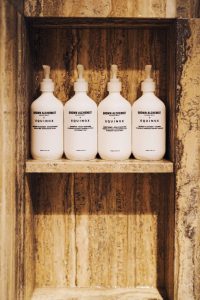 grown alchemist bathroom amenities shampoo conditioner and AM and PM body wash