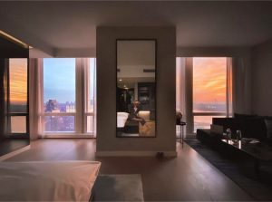 hotel room with sunset viewed through windows