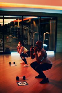 couple working out in fitness center studio
