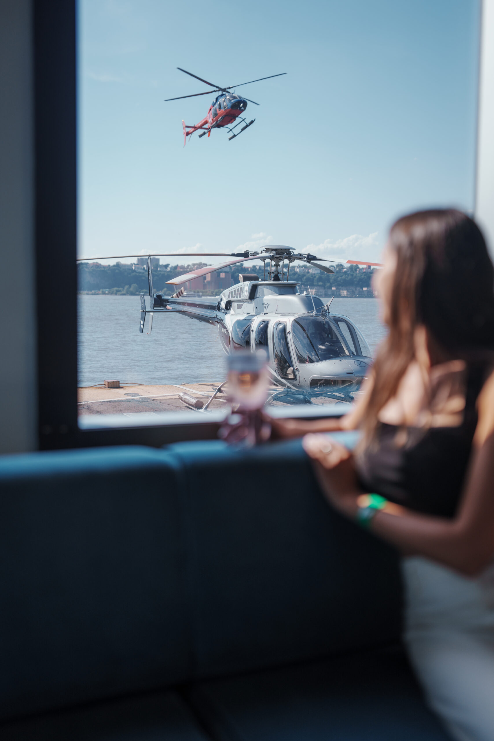 Two helicopters and a girl looking through the window