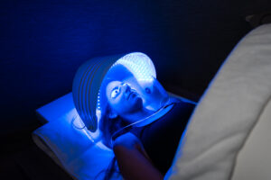 Girl with glasses in a tanning bed