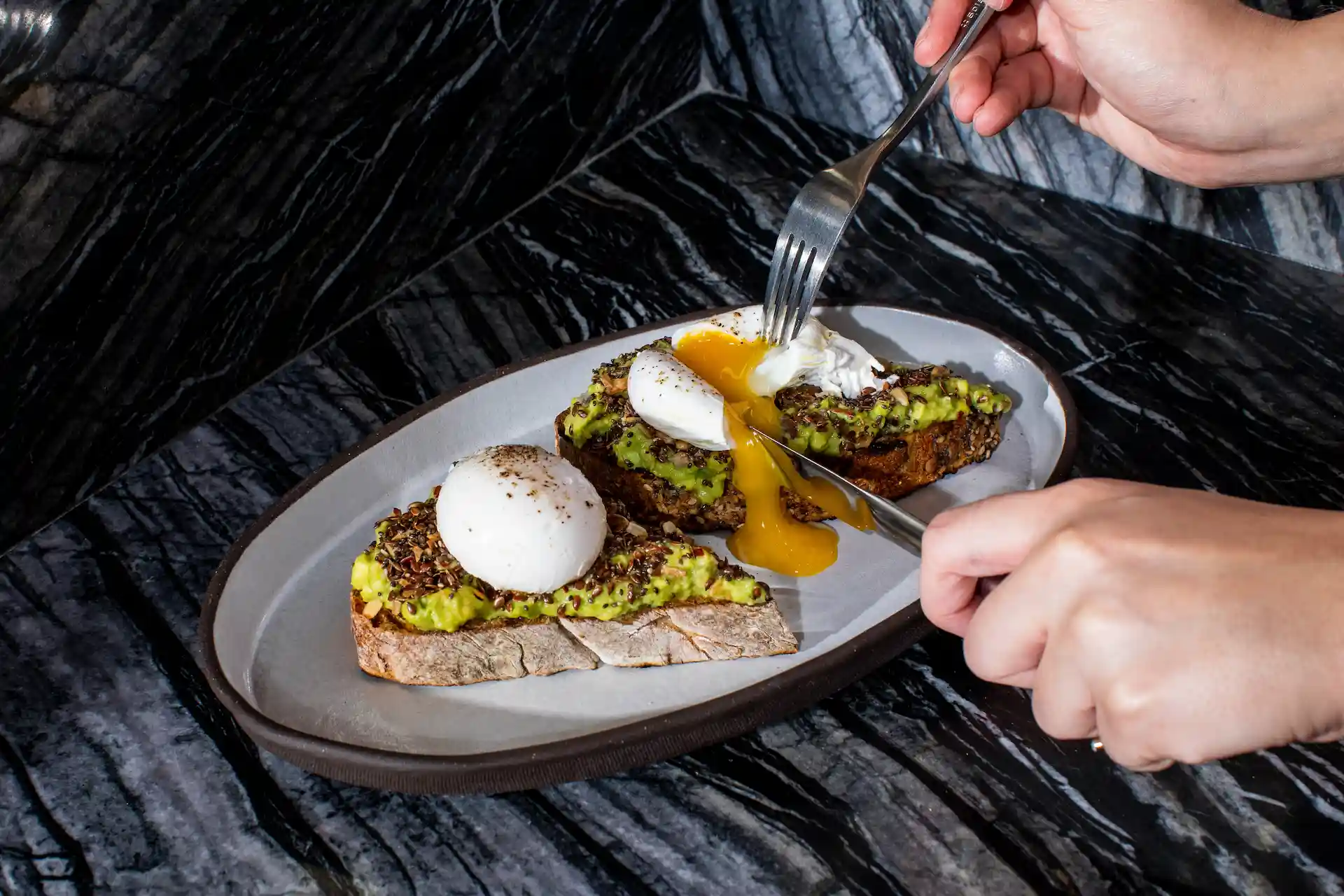 <toast with guacamole and egg