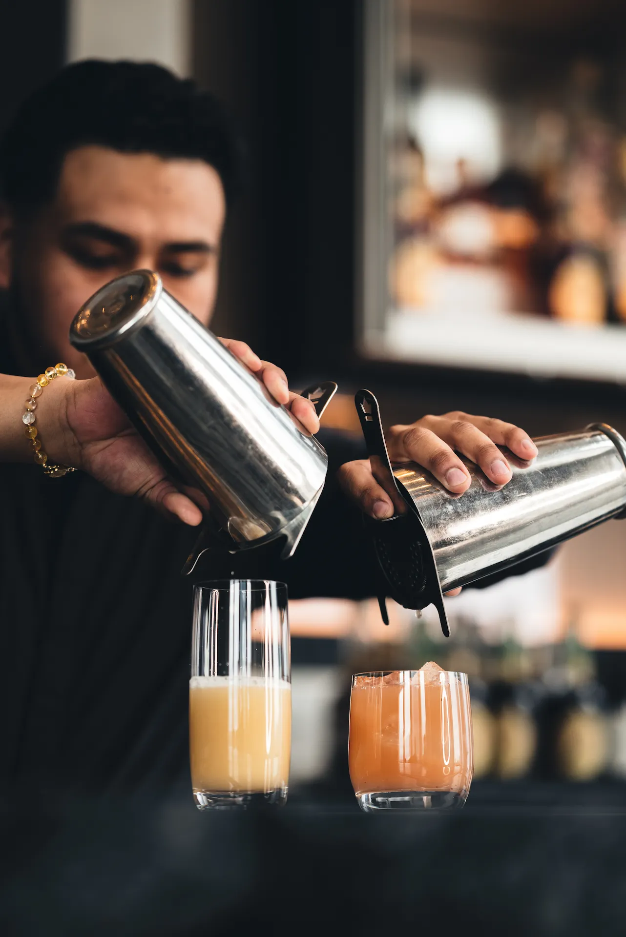 <bartender making cocktails